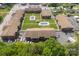 Community aerial view showcasing manicured lawns, multiple buildings, two pools, and convenient parking at 123 Carriage House Dr, Kannapolis, NC 28081