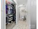 Bathroom featuring a shower and a closet with shelving at 123 Carriage House Dr, Kannapolis, NC 28081