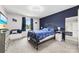 Stylish bedroom featuring a modern accent wall, plush carpet, and complementary decor at 123 Carriage House Dr, Kannapolis, NC 28081