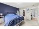Stylish bedroom featuring a modern accent wall, plush carpet, and complementary decor at 123 Carriage House Dr, Kannapolis, NC 28081