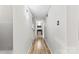 Bright hallway featuring modern lighting, hardwood flooring, and convenient access to multiple rooms at 123 Carriage House Dr, Kannapolis, NC 28081