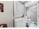 Laundry area with stacked washer and dryer next to the bathroom at 123 Carriage House Dr, Kannapolis, NC 28081