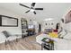A bright living room features wood flooring, comfortable seating, and modern décor at 123 Carriage House Dr, Kannapolis, NC 28081