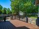 Elevated back deck with views of the landscaped yard and detached shed at 1257 Mill Race Ln, Matthews, NC 28104