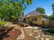Back of home, featuring deck, screened porch and manicured backyard at 1257 Mill Race Ln, Matthews, NC 28104
