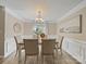 Inviting dining room with natural light, showcasing a neutral color palette and elegant decor for memorable meals at 1257 Mill Race Ln, Matthews, NC 28104