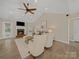 Bright living room featuring a cozy fireplace, vaulted ceilings, and a comfortable seating area at 1257 Mill Race Ln, Matthews, NC 28104