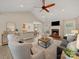 Open concept living room featuring a fireplace, vaulted ceilings, and views of the kitchen at 1257 Mill Race Ln, Matthews, NC 28104