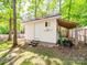 The backyard shed has steps and a small covered area for storage at 1257 Mill Race Ln, Matthews, NC 28104