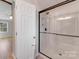 Modern bathroom featuring a frameless glass shower with white subway tile and black hardware at 12620 Sulgrave Dr, Huntersville, NC 28078