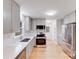 Modern kitchen with stainless steel appliances, white subway tile backsplash, and elegant gray cabinets at 12620 Sulgrave Dr, Huntersville, NC 28078