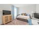 Neutral bedroom featuring a trundle bed, a large window, and a workspace at 1316 Colgher St, Mint Hill, NC 28227