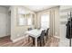 Cozy dining area with a white table, seating for four, and bright natural light at 1316 Colgher St, Mint Hill, NC 28227