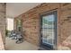 Charming front porch with seating, a brick facade, and a welcoming front door at 1316 Colgher St, Mint Hill, NC 28227
