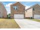 Exterior view of the brick home with a 2-car garage and a long driveway at 1316 Colgher St, Mint Hill, NC 28227