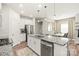 Bright kitchen with a large island, modern appliances, and an adjacent dining area at 1316 Colgher St, Mint Hill, NC 28227