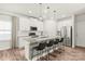 Sleek kitchen with white cabinets, stainless steel appliances, and a granite island with seating at 1316 Colgher St, Mint Hill, NC 28227