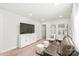 Comfortable living room featuring a brown sofa, a media center, and recessed lighting at 1316 Colgher St, Mint Hill, NC 28227