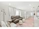 Spacious living room featuring modern furniture, and ample natural light at 1316 Colgher St, Mint Hill, NC 28227