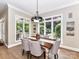 Bright dining room with large windows and ample natural light overlooking backyard at 14650 Trading Path Way, Charlotte, NC 28277