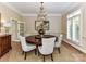 Formal dining room with round table, chandelier, and natural light at 14650 Trading Path Way, Charlotte, NC 28277