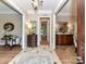 Elegant foyer with tile floors, wooden accents, and stylish furnishings at 14650 Trading Path Way, Charlotte, NC 28277