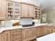 Close-up of kitchen with premium countertops, cabinets, and gas cooktop at 14650 Trading Path Way, Charlotte, NC 28277