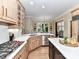 Gourmet kitchen with stainless steel appliances, white countertops, and open layout at 14650 Trading Path Way, Charlotte, NC 28277