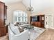 Cozy living room with large windows, high ceilings, and elegant decor at 14650 Trading Path Way, Charlotte, NC 28277