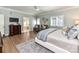 Main bedroom with wood floors and view to luxury ensuite bath at 14650 Trading Path Way, Charlotte, NC 28277