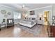 Serene main bedroom with wood floors, ceiling fan, and walk-in closet at 14650 Trading Path Way, Charlotte, NC 28277