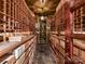 Spacious wine cellar with custom wooden racks and slate flooring at 14650 Trading Path Way, Charlotte, NC 28277