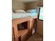 RV bedroom featuring two bunk beds, a ladder, and storage at 148 Sunshine Trl # A165, Mount Gilead, NC 27306