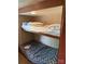 RV bedroom featuring two bunk beds, a ladder, and storage at 148 Sunshine Trl # A165, Mount Gilead, NC 27306