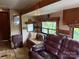 RV living room featuring a sofa, booth seating, and mirrored wall at 148 Sunshine Trl # A165, Mount Gilead, NC 27306