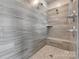 Beautiful bathroom featuring modern tiled shower with shower head and built-in bench at 14925 Baldridge Dr, Huntersville, NC 28078