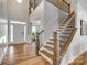 Grand foyer with hardwood floors, staircase, and natural light at 14925 Baldridge Dr, Huntersville, NC 28078