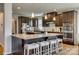 Spacious kitchen featuring a large island with seating, granite countertops, and modern, stainless steel appliances at 14925 Baldridge Dr, Huntersville, NC 28078