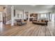 Open-concept living area with wood floors seamlessly connecting living spaces at 14925 Baldridge Dr, Huntersville, NC 28078