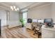 Bright office with wood floors, natural light, and functional setup at 14925 Baldridge Dr, Huntersville, NC 28078