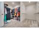 Bright and spacious walk-in closet with shelving and ample storage space for clothes at 14925 Baldridge Dr, Huntersville, NC 28078