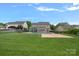 Large backyard with an in-ground pool, covered patio perfect for entertaining, and ample green space at 156 Pecan Hills Dr, Mooresville, NC 28115