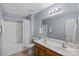 This bathroom features tile flooring, a double sink vanity and a tub at 156 Pecan Hills Dr, Mooresville, NC 28115