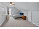 This bedroom features carpet, blue walls, a ceiling fan and window at 156 Pecan Hills Dr, Mooresville, NC 28115