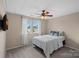 This bedroom has carpet, neutral walls, a ceiling fan, window and tv at 156 Pecan Hills Dr, Mooresville, NC 28115
