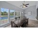 Dining room featuring multiple windows with views of the pool and backyard at 156 Pecan Hills Dr, Mooresville, NC 28115