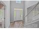 A bright entryway that features a beautiful front door, a transom window and side windows at 156 Pecan Hills Dr, Mooresville, NC 28115