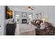 Cozy living room with a fireplace, plush seating, and ample natural light at 156 Pecan Hills Dr, Mooresville, NC 28115