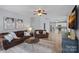 Open living room showcasing hardwood floors and modern decor at 156 Pecan Hills Dr, Mooresville, NC 28115