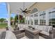 Covered patio includes comfortable seating and beautiful backyard views at 156 Pecan Hills Dr, Mooresville, NC 28115